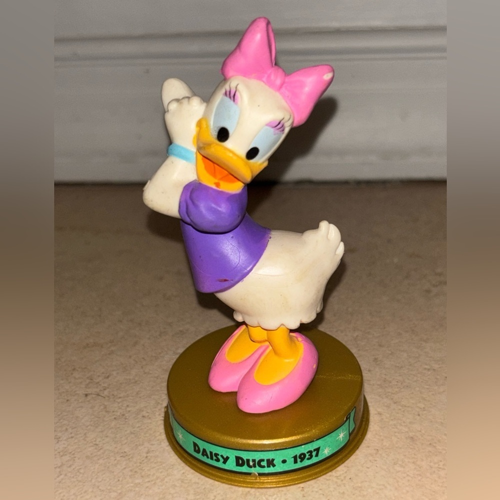 Disney Daisy Duck Figurine with Pink and Purple Outfit